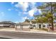 A spacious two-story home with a three-car garage and desert landscaping at 3710 E Oquendo Rd, Las Vegas, NV 89120
