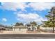 Two-story home with a three-car garage and well-maintained yard at 3710 E Oquendo Rd, Las Vegas, NV 89120