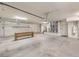 Spacious garage featuring ample lighting and a large work bench at 3710 E Oquendo Rd, Las Vegas, NV 89120