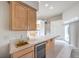 Bright kitchen featuring stainless steel appliances, tile countertops, and a tiled floor at 3710 E Oquendo Rd, Las Vegas, NV 89120