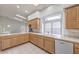 Bright eat-in kitchen with lots of cabinet space, a double sink, and stainless steel dishwasher at 3710 E Oquendo Rd, Las Vegas, NV 89120