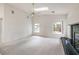 A bright living area with neutral walls, a fireplace, and large windows that bring in plenty of natural light at 3710 E Oquendo Rd, Las Vegas, NV 89120