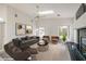 Bright, airy living room with a fireplace, skylight, modern furniture, and a serene, open feel at 3710 E Oquendo Rd, Las Vegas, NV 89120