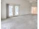 Spacious main bedroom with a ceiling fan and access to the backyard at 3710 E Oquendo Rd, Las Vegas, NV 89120