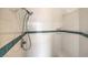Detailed view of a tiled shower featuring a handheld shower head and built-in niche with tile accent at 3710 E Oquendo Rd, Las Vegas, NV 89120