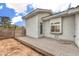 A small side yard with desert ground cover and access to a gated area offers low maintenance at 3710 E Oquendo Rd, Las Vegas, NV 89120