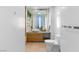 A clean, well-lit bathroom with a contemporary vessel sink and wooden drawers at 3722 Las Vegas Blvd # 2204, Las Vegas, NV 89158
