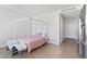 Chic bedroom featuring a four-poster bed, sleek finishes, and modern decor at 3722 Las Vegas Blvd # 2204, Las Vegas, NV 89158
