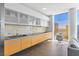 Modern kitchen featuring wooden cabinets, sleek appliances and a dining area at 3722 Las Vegas Blvd # 2204, Las Vegas, NV 89158