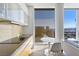 Modern kitchenette featuring sleek cabinets, a dining table, and stunning city views at 3722 Las Vegas Blvd # 2204, Las Vegas, NV 89158
