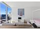 Stylish living area with cityscape views, unique art, and a cozy gray sofa at 3722 Las Vegas Blvd # 2204, Las Vegas, NV 89158