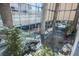 Spacious lobby with tall columns, glass walls, and indoor plants at 3722 Las Vegas Blvd # 2204, Las Vegas, NV 89158