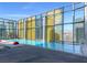 Bright pool with a clear blue water and multiple lounge chairs against a city view and steel and glass building at 3722 Las Vegas Blvd # 2204, Las Vegas, NV 89158
