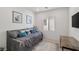 Cozy bedroom with a daybed, throw pillows, and natural light from the window at 4096 E Cactus Canyon Dr, Pahrump, NV 89061