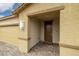 Covered front porch with brick pavers, stylish lighting fixture, and neutral-colored exterior at 4096 E Cactus Canyon Dr, Pahrump, NV 89061