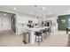 Modern kitchen with white cabinets, a quartz island, stainless steel appliances, and pendant lights at 4096 E Cactus Canyon Dr, Pahrump, NV 89061
