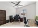 Office with a ceiling fan, a window, carpet and a full workstation setup at 4096 E Cactus Canyon Dr, Pahrump, NV 89061