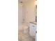 Well-lit bathroom with a tub, shower, toilet, and white vanity at 4417 Rita Dr, Las Vegas, NV 89121