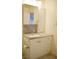 Bathroom vanity featuring gray countertop and decorative backsplash at 4417 Rita Dr, Las Vegas, NV 89121