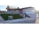 Well-maintained single-story home with manicured front yard, desert landscaping, and paved driveway at 4417 Rita Dr, Las Vegas, NV 89121