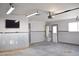 Finished garage space featuring lighting, a mounted television, and water heater at 4417 Rita Dr, Las Vegas, NV 89121