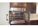 This kitchen features a built-in stainless oven and dark wood cabinetry at 4417 Rita Dr, Las Vegas, NV 89121