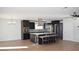 Spacious kitchen with a central island, modern appliances, and a ceiling fan at 4417 Rita Dr, Las Vegas, NV 89121