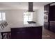 The open kitchen showcases a marble countertop, stainless appliances, and backyard access at 4417 Rita Dr, Las Vegas, NV 89121
