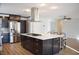 Modern kitchen with a large island, stainless steel appliances, and sleek cabinetry at 4417 Rita Dr, Las Vegas, NV 89121