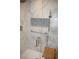 Walk-in shower boasts marble tile, a niche for storage, and a sleek glass door, blending style and functionality at 4417 Rita Dr, Las Vegas, NV 89121