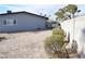 Side yard view showcasing a privacy wall, low shrubs and potential for landscaping or other improvements at 4417 Rita Dr, Las Vegas, NV 89121