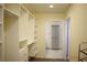 Bright walk-in closet includes custom organizers, shelving, and easy access to adjacent bathroom at 4417 Rita Dr, Las Vegas, NV 89121