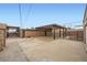 Backyard featuring a covered patio, inground pool with fencing, and large concrete surface at 442 Republic St, Henderson, NV 89015