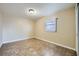 Bright bedroom featuring tile floors, a window, and a flush mount light at 442 Republic St, Henderson, NV 89015