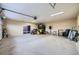 Spacious garage with overhead lighting, a sliding glass door and room for storage at 442 Republic St, Henderson, NV 89015