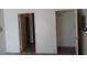Bright bedroom featuring neutral walls and carpet with multiple doors and closet access at 4865 S Torrey Pines Dr # 106, Las Vegas, NV 89103