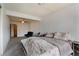 A simple bedroom with neutral walls, ceiling fan, and carpet floors at 5016 Roswell St, Las Vegas, NV 89120