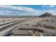 An aerial view of rooftops showcasing the location near the highway, mountains, and city at 5204 Sunstone Mesa Dr, Las Vegas, NV 89166