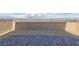 This backyard features a view of the city, a block wall and a brick patio area at 5204 Sunstone Mesa Dr, Las Vegas, NV 89166