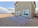 The backyard features a brick patio, gravel area and mountain views at 5204 Sunstone Mesa Dr, Las Vegas, NV 89166