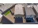 Aerial view of backyard with patio, landscaped area, and artificial turf at 5204 Sunstone Mesa Dr, Las Vegas, NV 89166