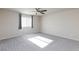 Bedroom featuring carpet, a window with curtains, and a ceiling fan at 5204 Sunstone Mesa Dr, Las Vegas, NV 89166