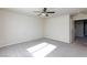 Bedroom with neutral carpet, ceiling fan, and a doorway at 5204 Sunstone Mesa Dr, Las Vegas, NV 89166