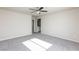 Large bedroom featuring carpet, a ceiling fan, and an ensuite bathroom at 5204 Sunstone Mesa Dr, Las Vegas, NV 89166
