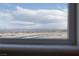 Window view of the city skyline, highway, and mountains in the distance at 5204 Sunstone Mesa Dr, Las Vegas, NV 89166