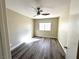 Bedroom with laminate flooring, natural lighting and ceiling fan at 56 Belle Point Ave, Las Vegas, NV 89123