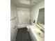 This bathroom features a tub and shower combo, with an above sink mirror at 5709 Goldmount Ave, Las Vegas, NV 89107