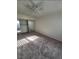 Cozy bedroom with a ceiling fan and a sliding door closet, ideal for relaxation at 5709 Goldmount Ave, Las Vegas, NV 89107