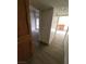 Hallway featuring updated flooring, connecting different rooms in the home at 5709 Goldmount Ave, Las Vegas, NV 89107