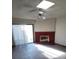 Comfortable living room featuring a fireplace with a red mantel and updated wood-look floors at 5709 Goldmount Ave, Las Vegas, NV 89107